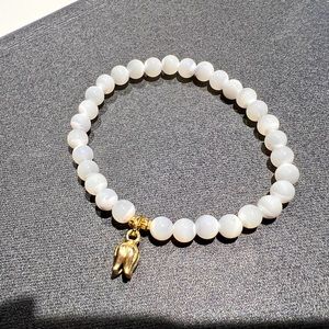 Mother of pearl bracelet with 14k gold filled lily of the valley Bracelet